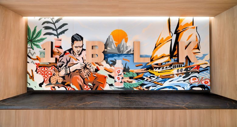 Colorful mural with bold letters and scenery.