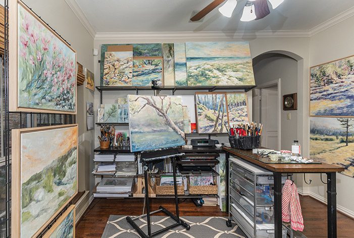 a room with art and paintings