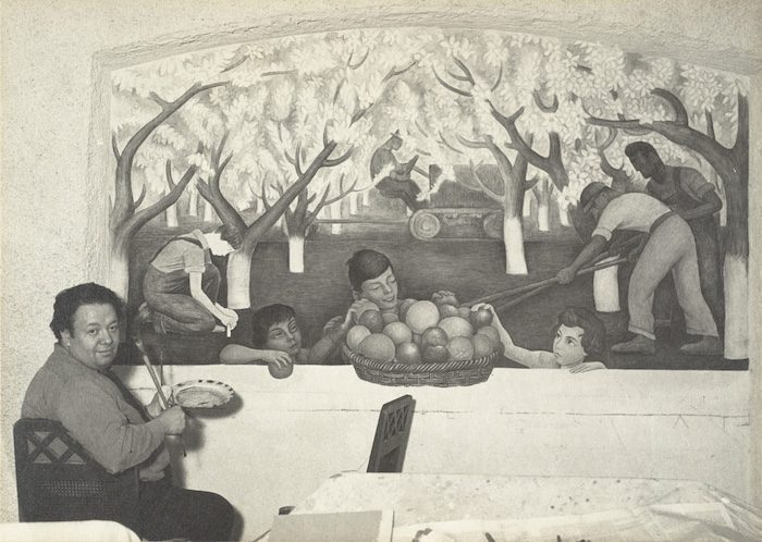 Diego Rivera painting a mural