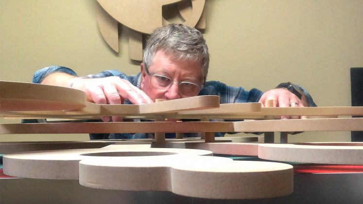 a man playing with wood