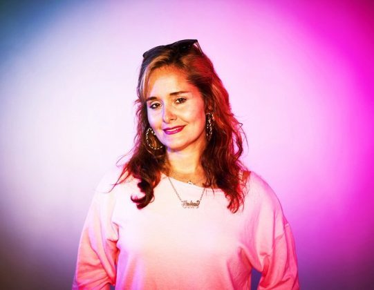 a woman in a pink shirt