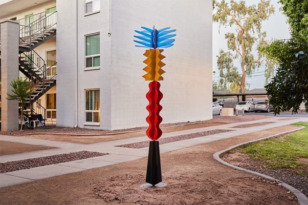 Colorful abstract sculpture in courtyard