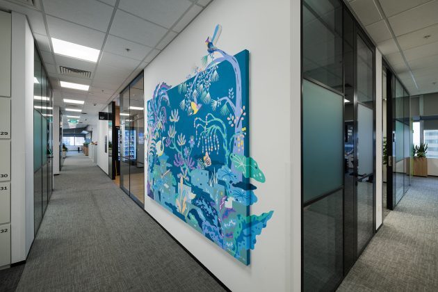 Colorful mural in modern office hallway