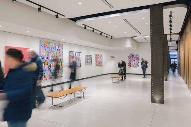 open art gallery with people walking